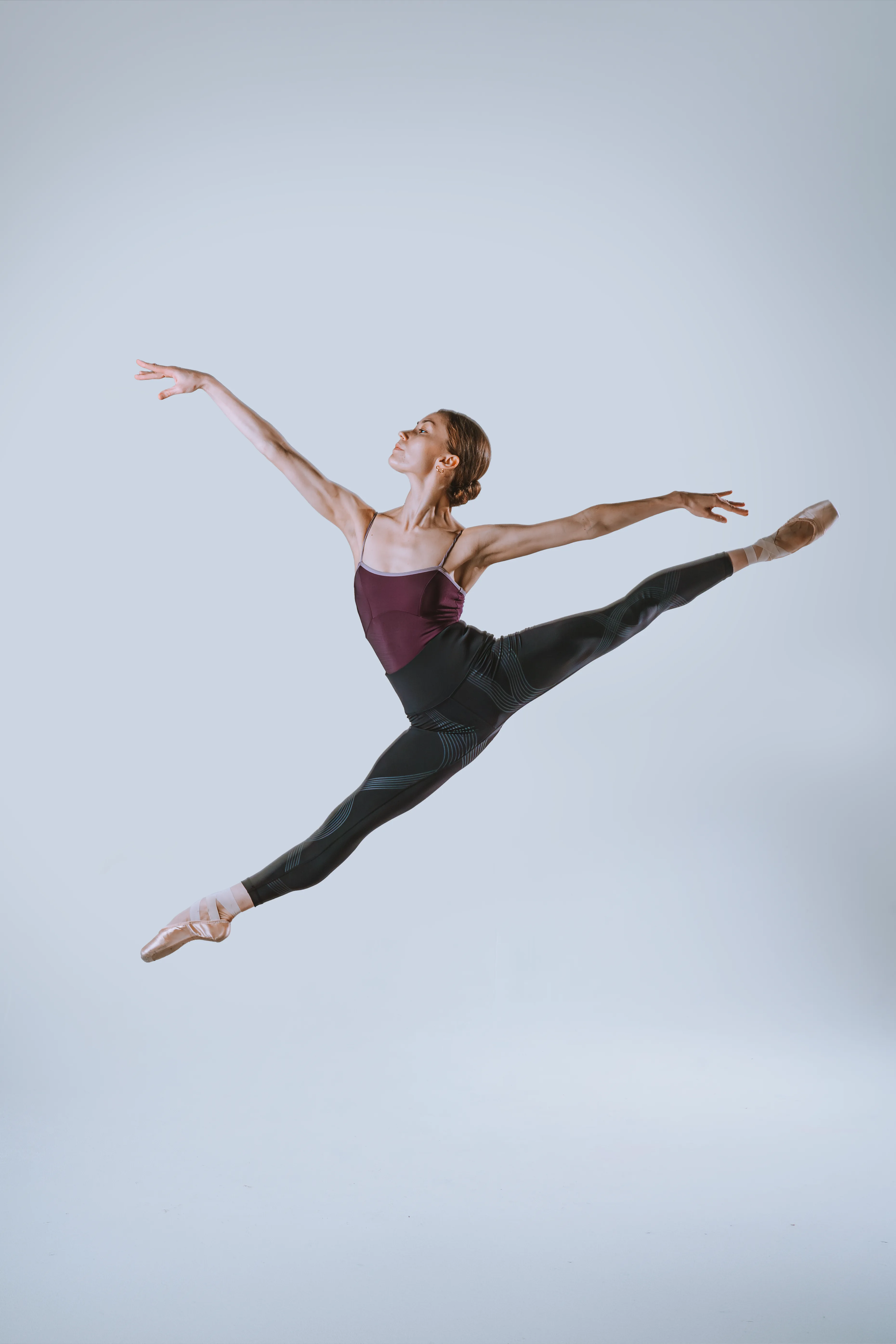 A ballerina mid grand jete